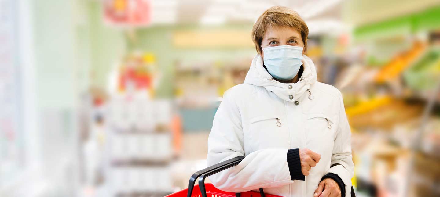 woman-at-grocery-store-wearing-protective-mask